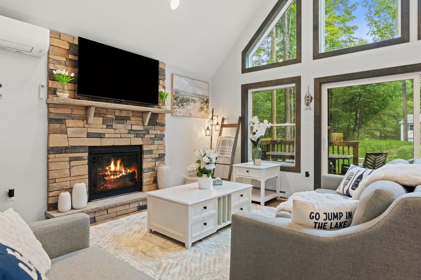Living room with stacked-stone fireplace